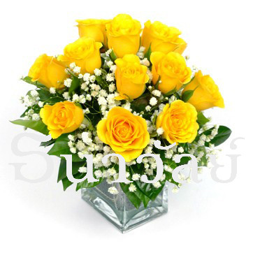 12 yellow rose in a glass vase